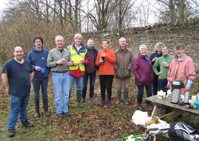 Sustainable Woodstock woodland volunteers taking a break together
